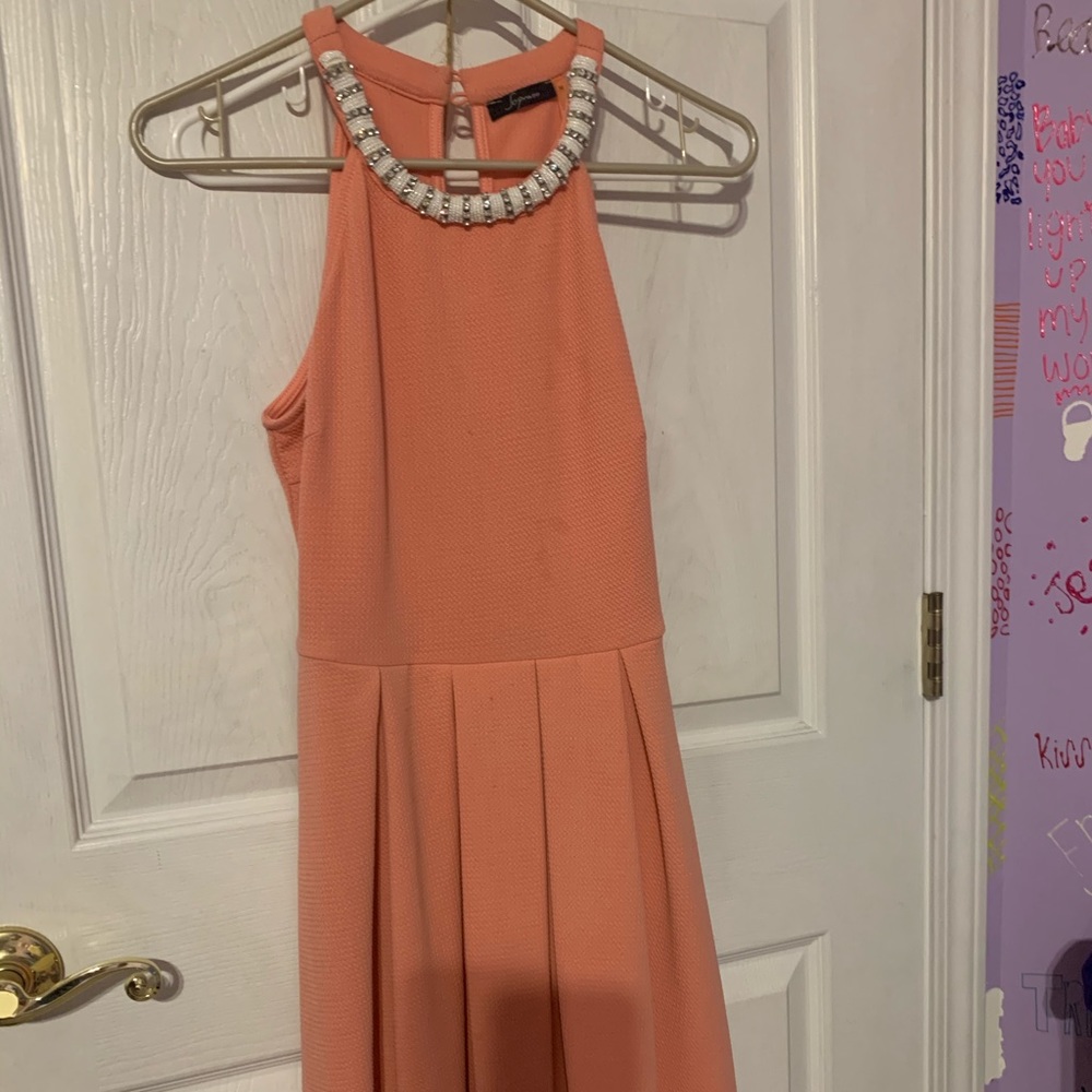 Soprano, coral dress with beaded neckline